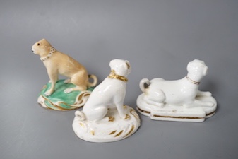 A Derby pug dog with white and gilt decoration, another pug dog perhaps Rockingham and an English porcelain pug dog, first half 19th century (3) 6cm